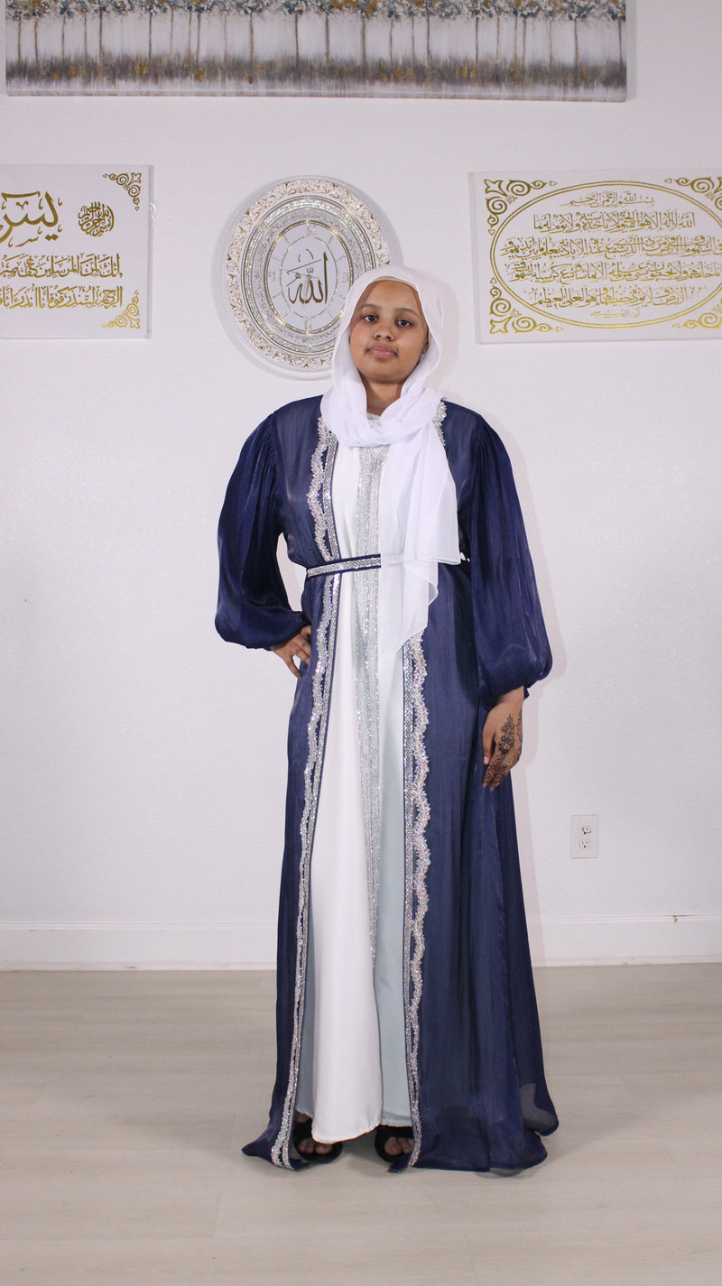 Woman in a navy abaya with white trim, Hayat's Fashion Houston